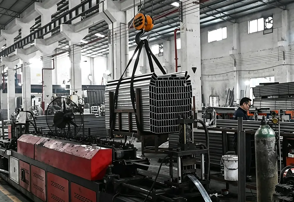 CNC punch press for beam pitch adjustment holes